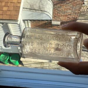 Abner Royce Pure Fruit Flavors Cleveland, Ohio embossed antique glass bottle